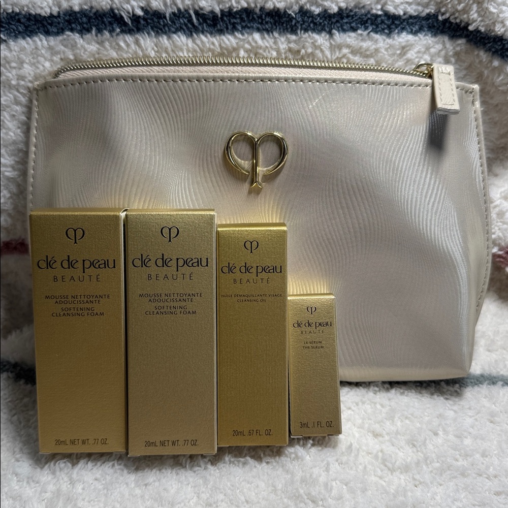 Cle de Peau Gold and Cream Cosmetic Bag with the travel size skin care, NWT
